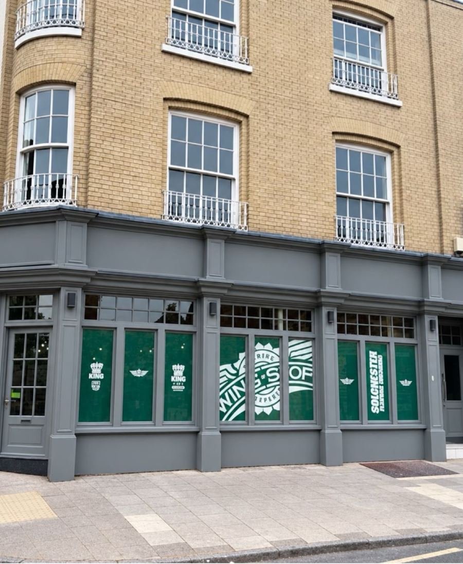 Completed Wingstop shopfront at the Colchester corner building
